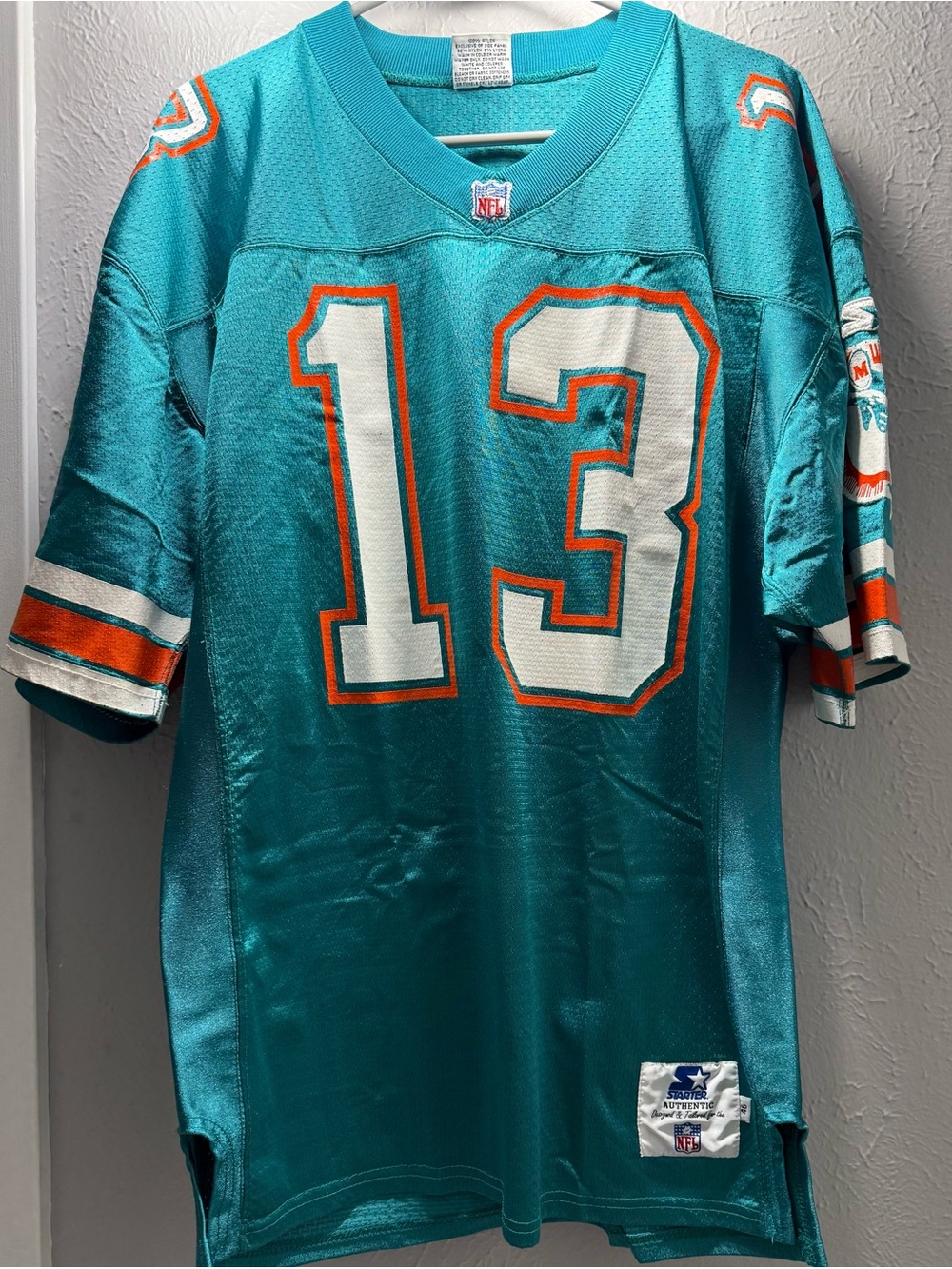 STARTER Teal Football Jersey with White & Orange NFL Crest